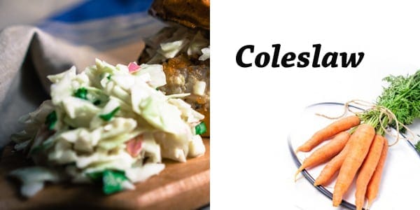 Coleslaw and carrots on a cutting board.