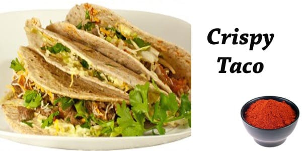 A taco with the words crispy taco on a plate.