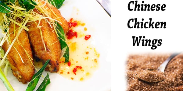 Chinese chicken wings served on a white plate at a restaurant near a garden center.