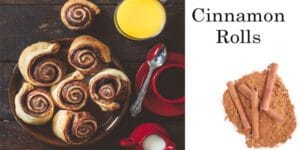 Cinnamon rolls and orange juice on a nursery table.