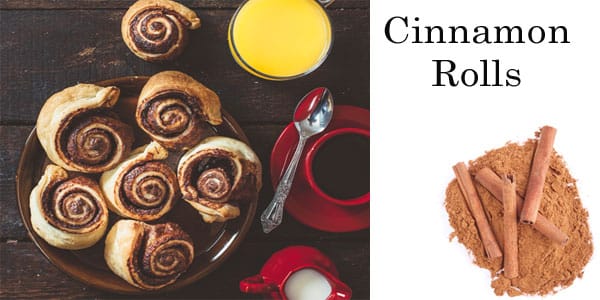 Cinnamon rolls and orange juice on a nursery table.
