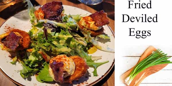 Fried deviled eggs served on a plate at a garden center near me.