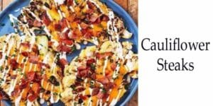 Cauliflower steaks plated on a blue dish.