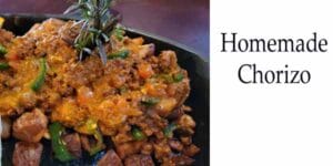 Homemade chorizo on a black plate at the best nursery near me.