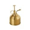 A small brass oil can on a white background at the best garden center near me.