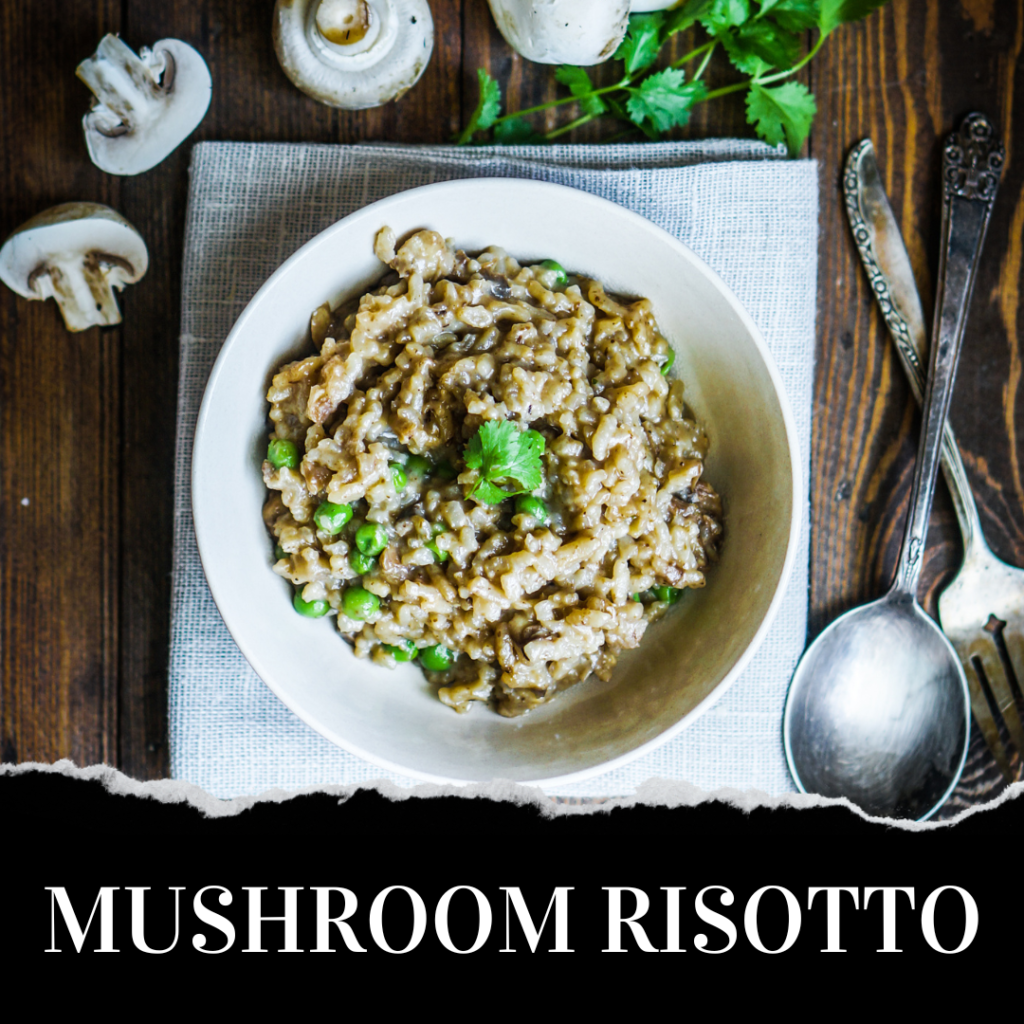 A bowl of mushroom risotto garnished with herbs, placed on a cloth napkin with a spoon, fork, and raw mushrooms beside it.