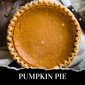 A whole pumpkin pie with a golden-brown crust, viewed from above, placed on a cloth next to a knife. The text "PUMPKIN PIE" appears at the bottom.