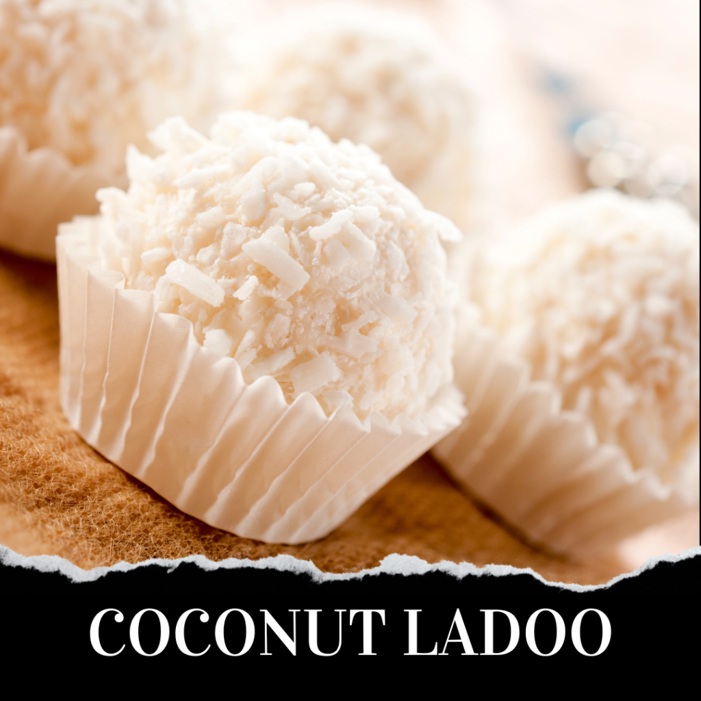 Close-up coconut ladoos in white paper cups with the text "COCONUT LADOO" at the bottom. The ladoos have a shredded coconut coating and are arranged neatly on a paper surface.