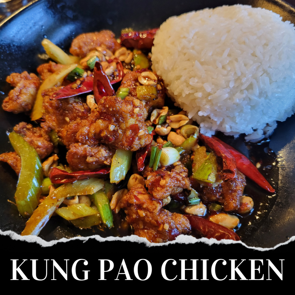 A plate of Kung Pao Chicken with peanuts and vegetables served alongside a portion of white rice.