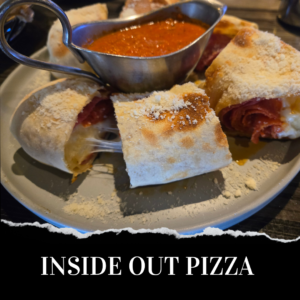 Stuffed pizza slices with cheese and salami, dusted with cheese, served with a metal sauce dish on a plate. Text: "Inside Out Pizza.