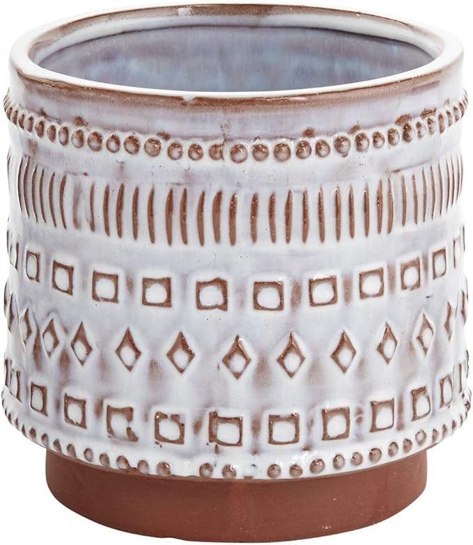 A ceramic planter with a geometric pattern in white and brown tones.