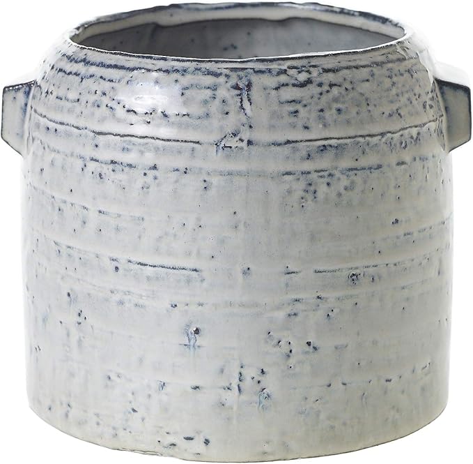 A textured, light gray ceramic pot with a cylindrical shape and indented handles on each side.