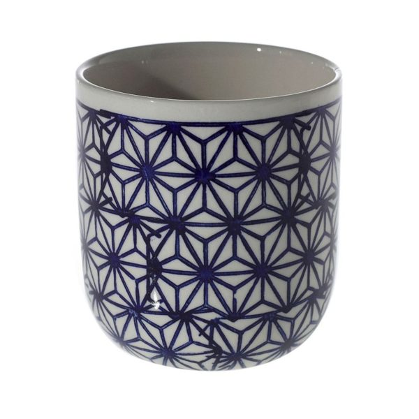 Ceramic cup with a deep blue geometric pattern on a white background.
