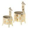 Two ceramic planter pots shaped like giraffes, featuring gold spots and elongated necks.