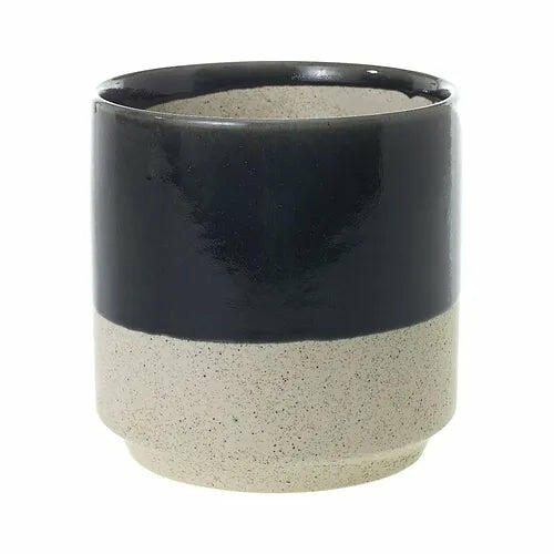 A two-toned ceramic planter with a glossy black upper section and a speckled beige lower half.