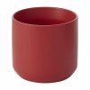 A plain red cylindrical ceramic cup with a smooth finish and no handle.